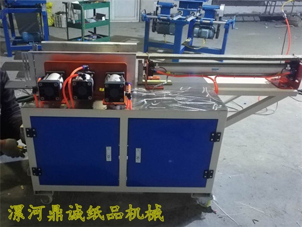 卷紙壓扁裝袋機